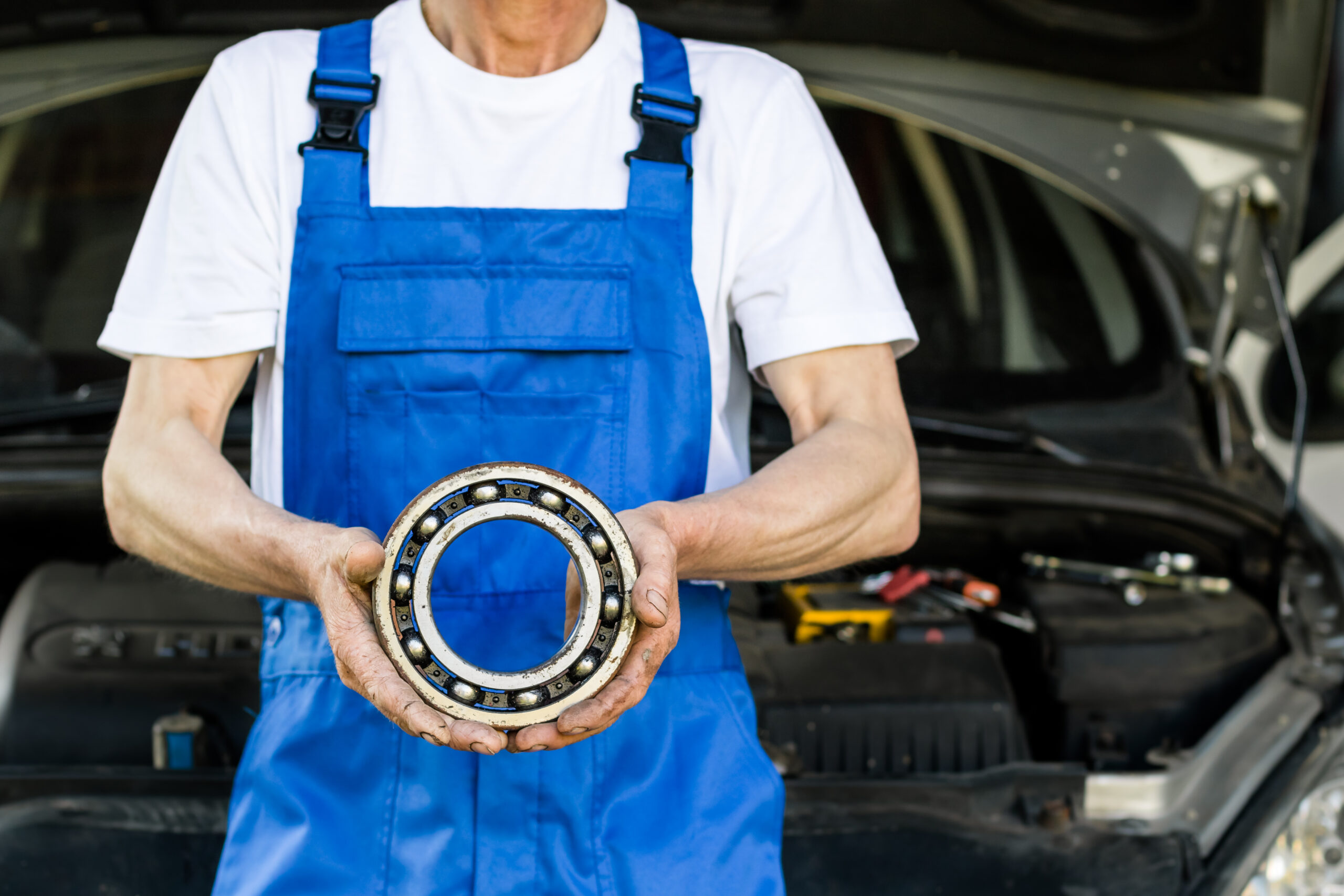 Mechanic holding a bearing.